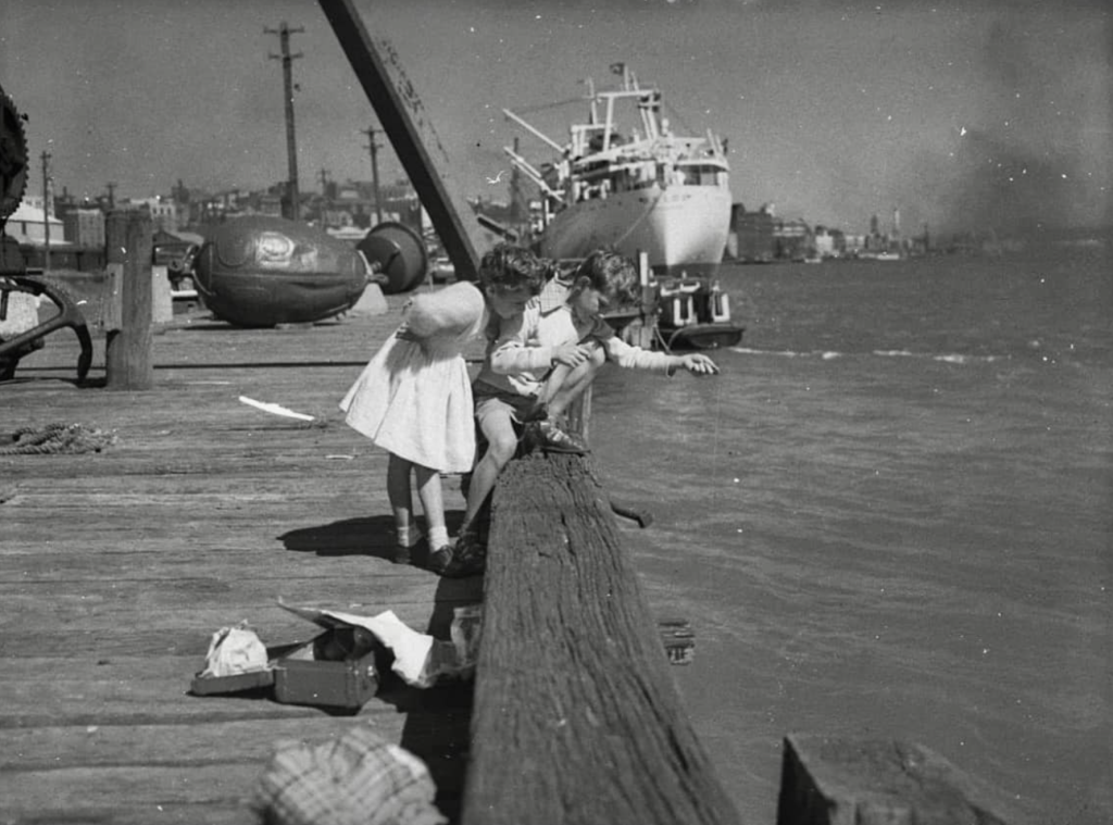 Photo 'Brother and sister fishing | Mitchell Library, State Library of NSW | Newcastle Morning Herald Archives - 12 April 1956.